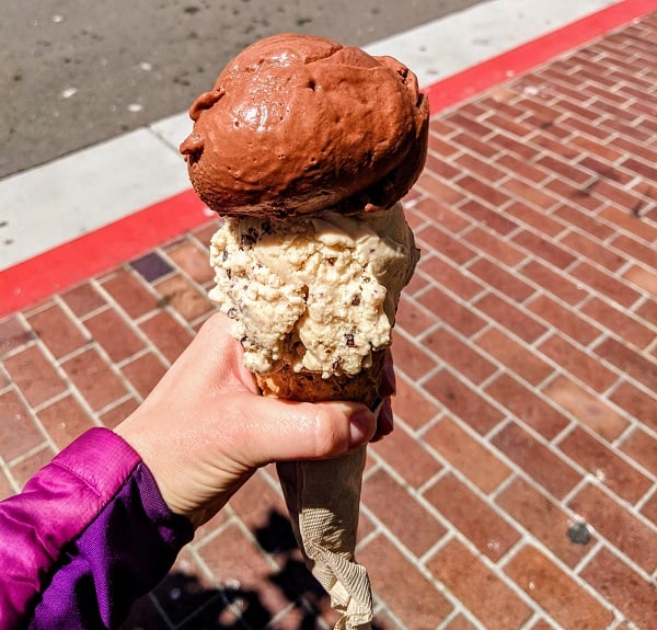 two scoops of vegan ice cream on a cone at revival ice cream in monterey