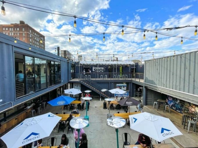 the courtyard eating area made of shipping containers at the shipping yard in detroit