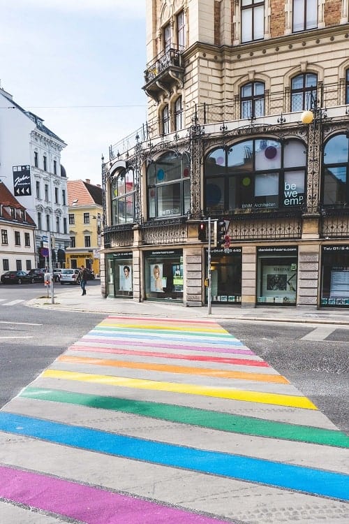 vienna city street with rainbow gay pride patter through the crosswalk