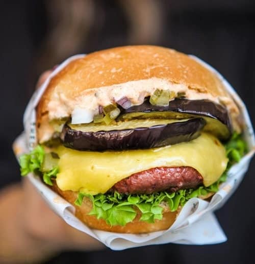 loaded vegan burger with cheese and eggplant from burger theory in paris