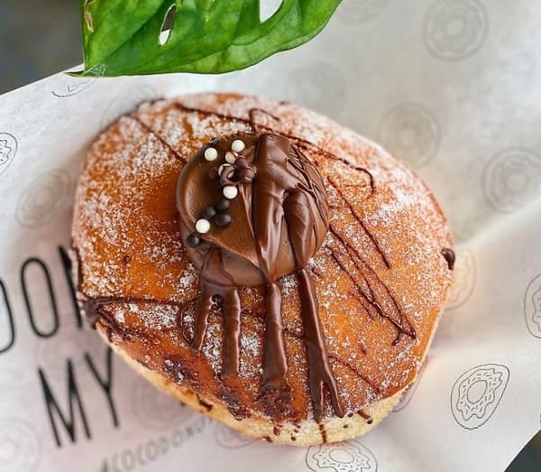 golden brown vegan chocolate bomb donut at coco donuts in brussels