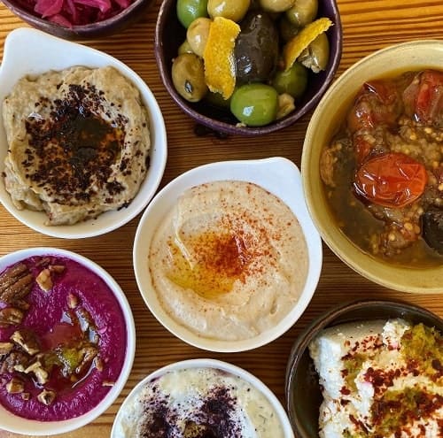multiple vegan middle eastern dishes from 1000 figs in new orleans