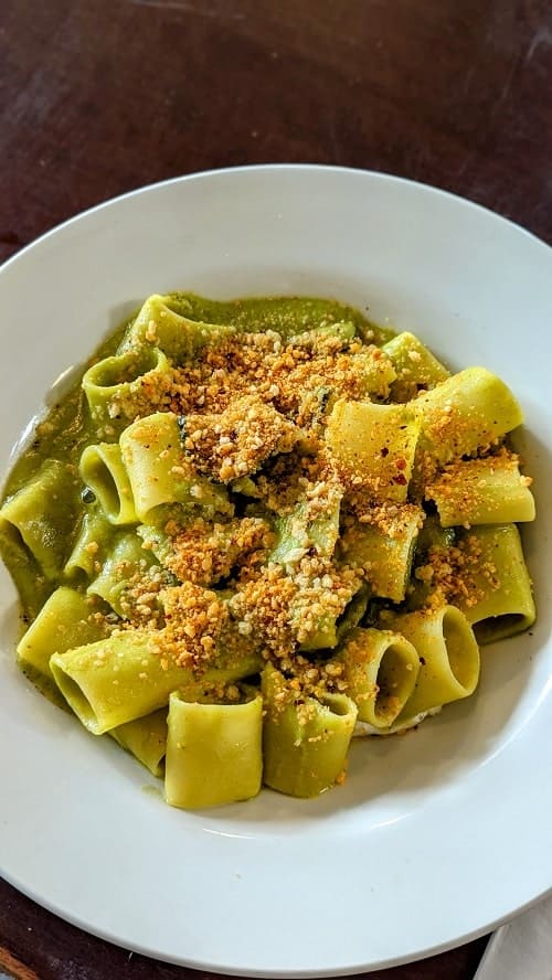 bowl of creamy vegan and gluten free pasta with bread crumbs at plant club london