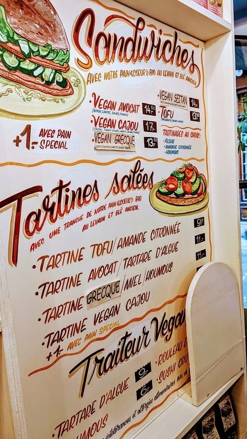 vegan sandwich and toast menu sign written in french at biofred in genevas old town