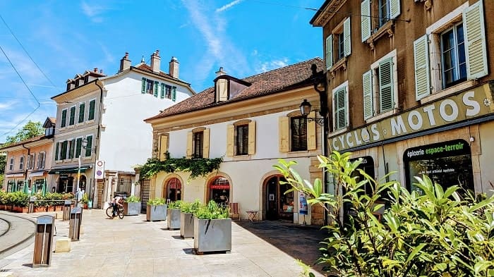 street corner in carouge geneva cream buildings look like an italian town