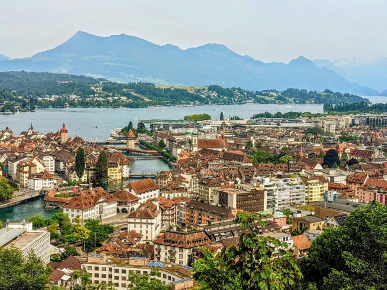 overhead view of the charming town of switzerland on a cloudy day with the mountains slightly appearing in the background