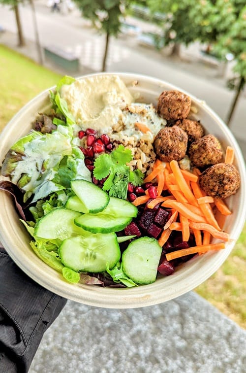 vegan falafel bowl with carrots, cucumbers, parsley, hummus and quinoa from dean and david in bern