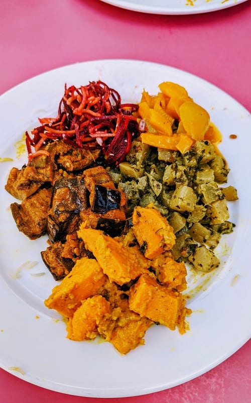 vegan indian food with sweet potato curry, eggplant, and potatoes from 3 dosha ayurveda