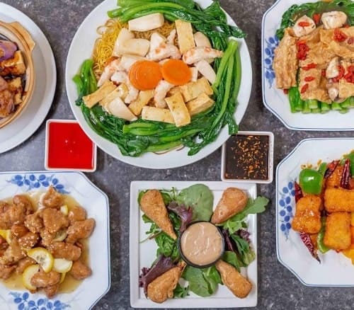 spread of vegan chinese dishes from buddhas vegan restaurant in toronto