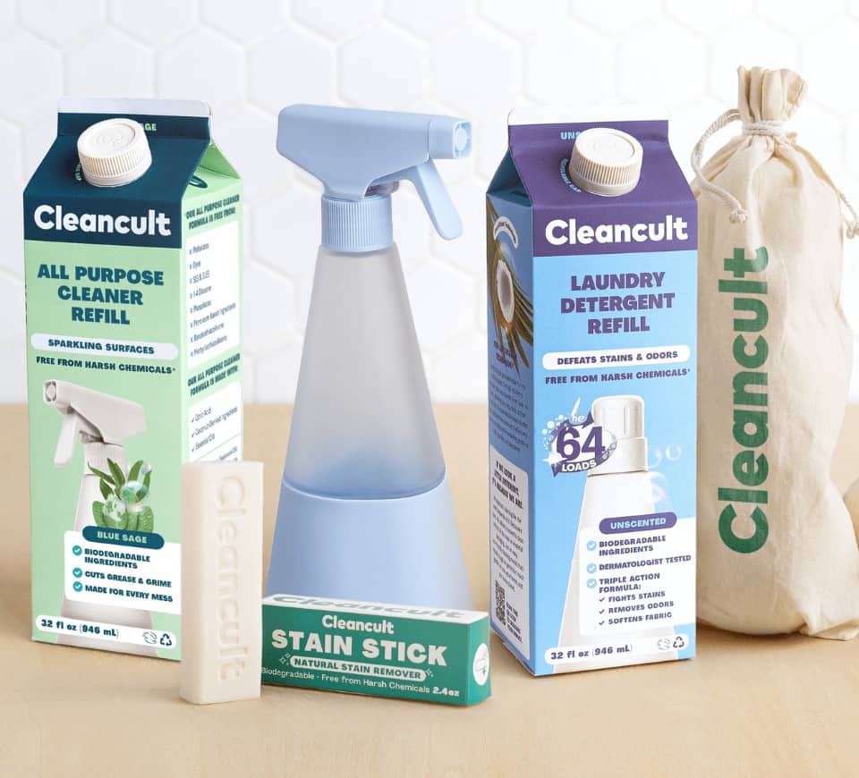 cleancult zero waste plastic free cleaning product lineup including a box of detergent, refillable bottle, cleaning spray, and dryer balls