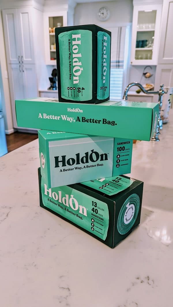 a tower of holdon compostable kitchen bags on a kitchen counter