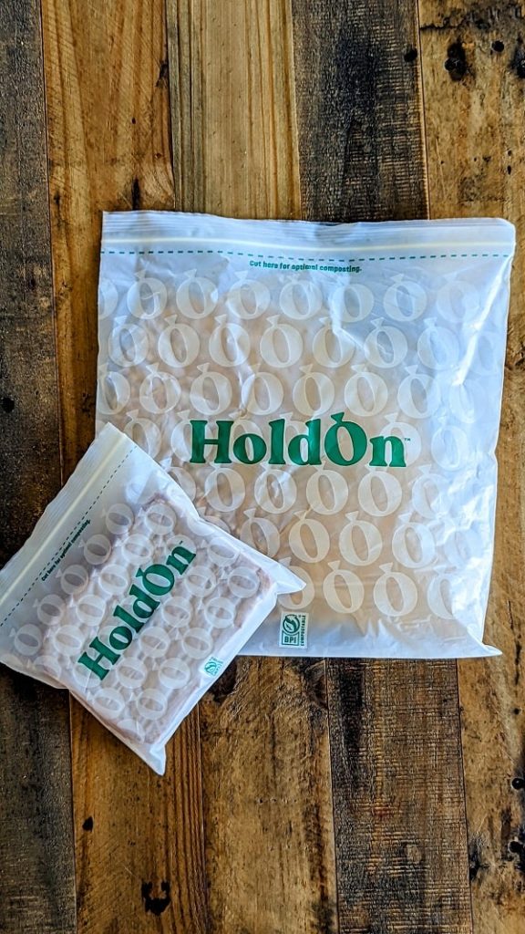 holdon compostable sandwich and gallon bags on a wood table