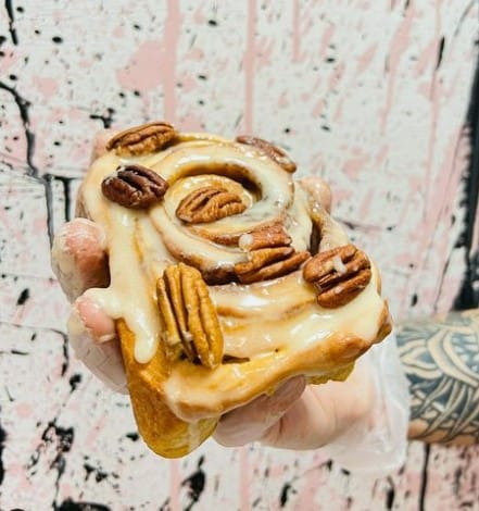 vegan sticky cinnamon bun covered in pecans from it's a trap in dublin