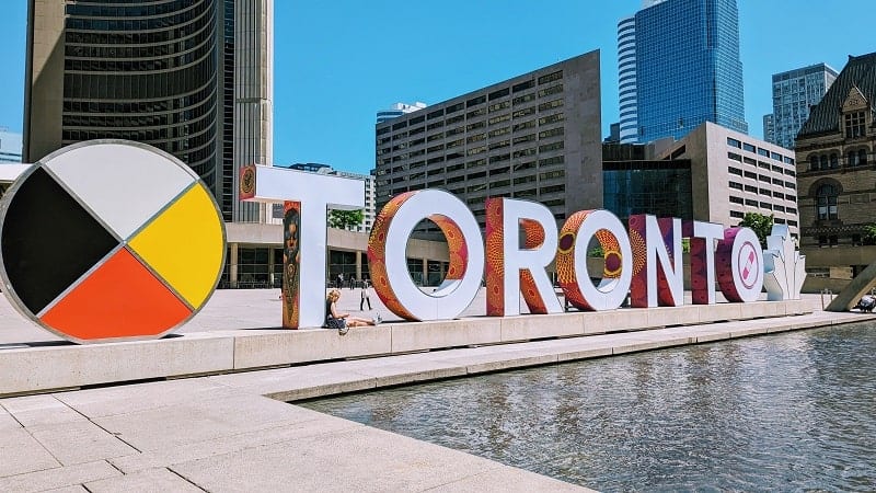 big silver block letters spelling our toronto in downtown toronto