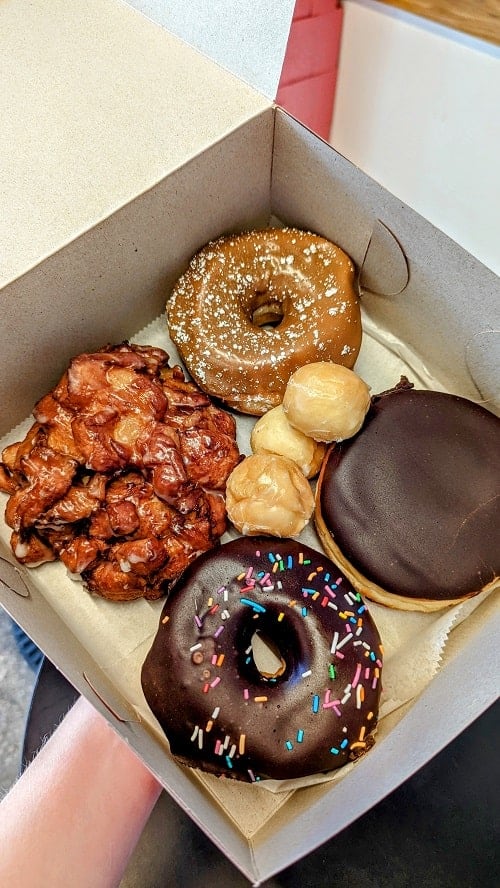 vegan donut assortment, donut holes, apple fritter, chocolate sprinkle, bostom cream in a white box washington dc
