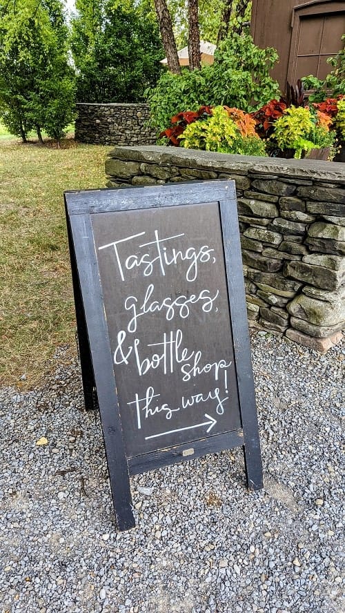 chalk board entrance sign for wine tastings at hermann wiemer vineyard