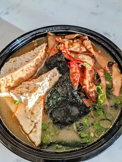 vegan udon noodle bowl with three tofu triangles from ima in detroit