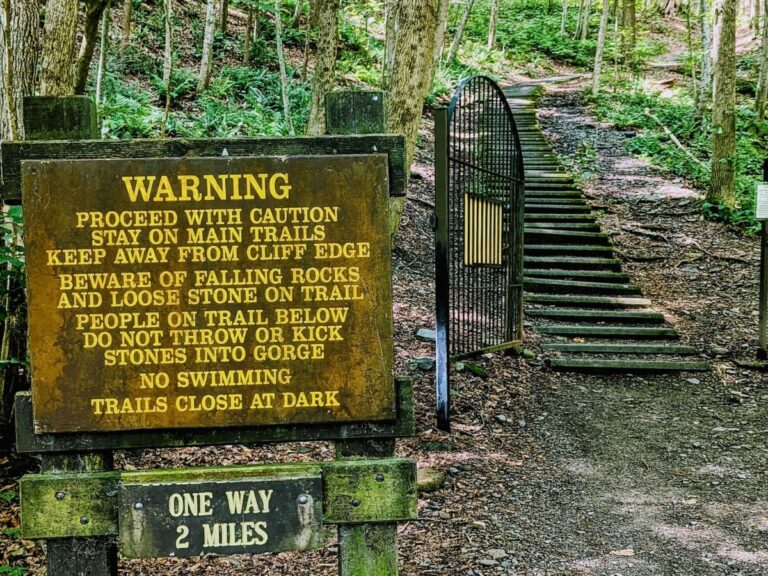 treman state park gorge hiking trail warning sign at trail entrance