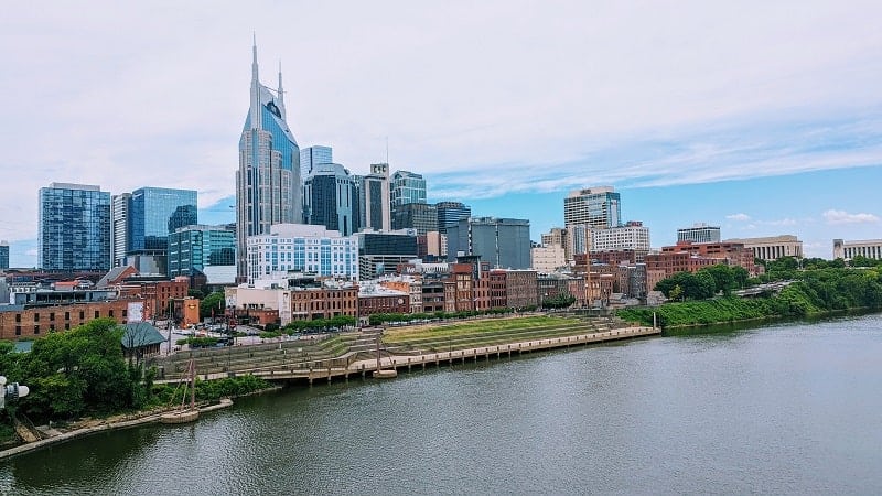 downtown nashville skyline on cumberland river on a partly cloudy day