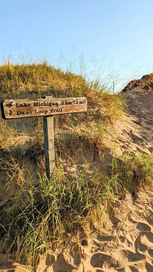 hiking trail sign in beach grass at sleeping bear point