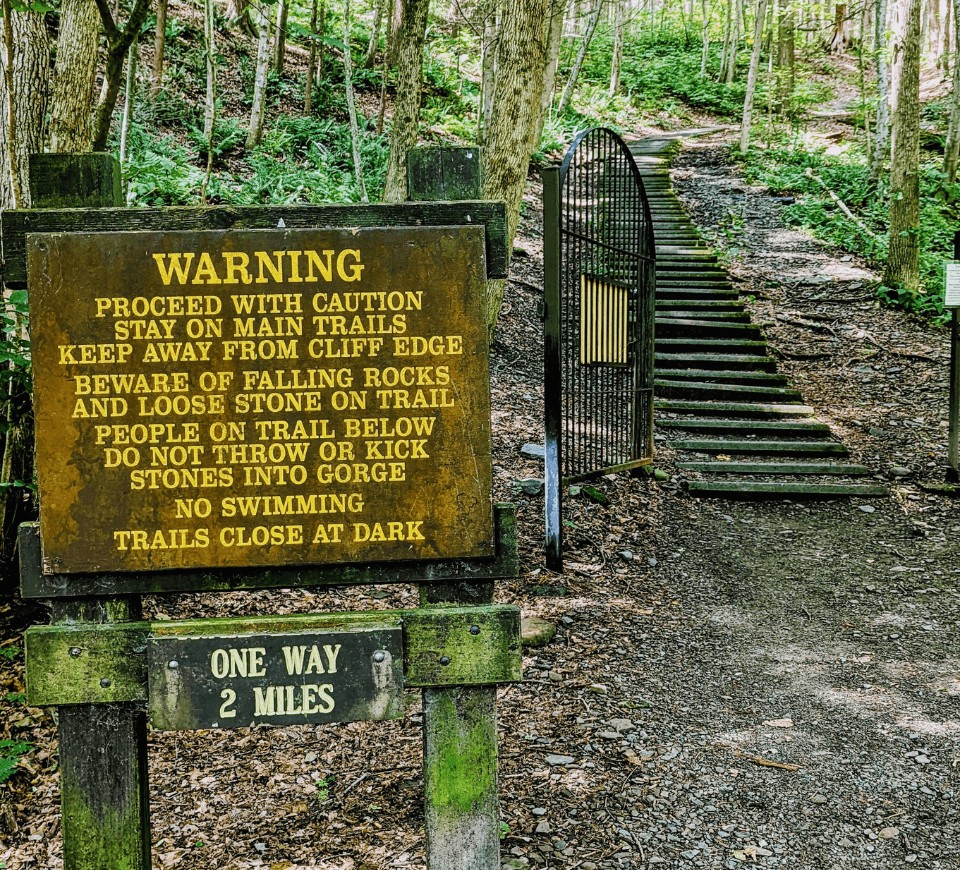 treman state park gorge hiking trail warning sign at trail entrance