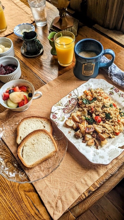 vegan breakfast with tofu scramble, toast, and fruit at william henry miller bed and breakfast in ithaca