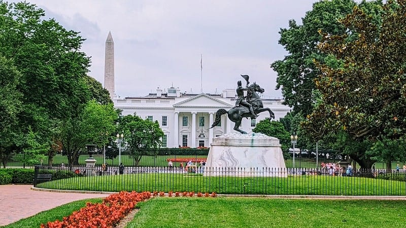 the white house taken from jackson square with the washington memorial in the background in dc