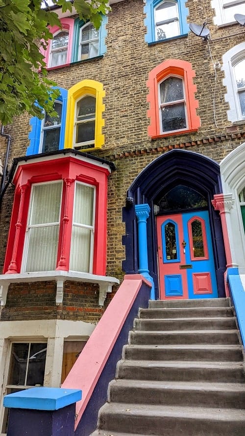 a rainbow colored brick window home in london