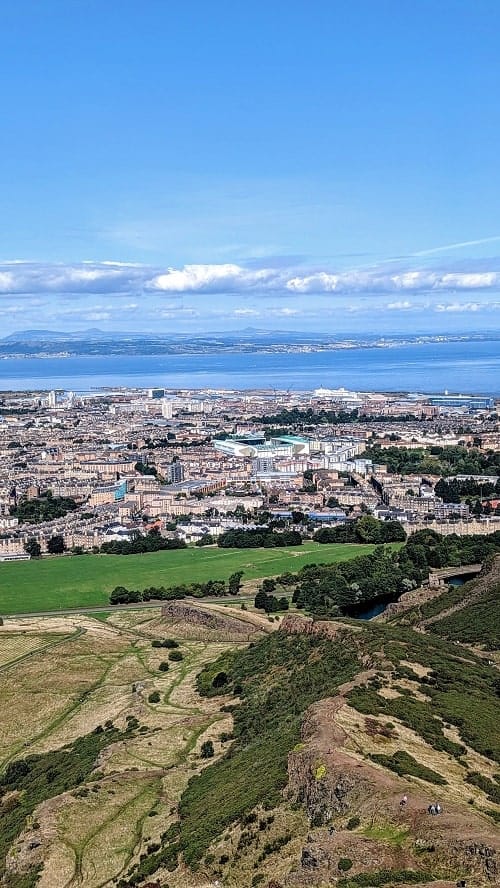 city and costal view of edinburgh from arthurs seat