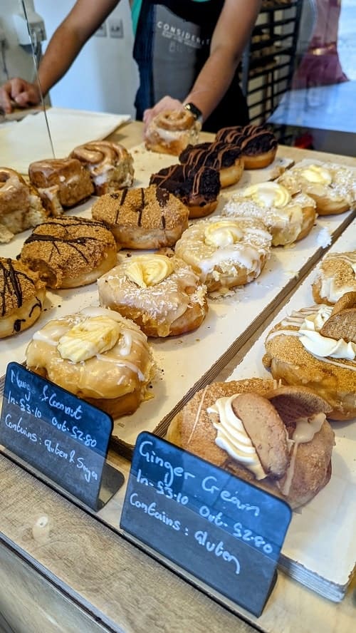 multiple lineups of golden vegan donuts in edinburgh