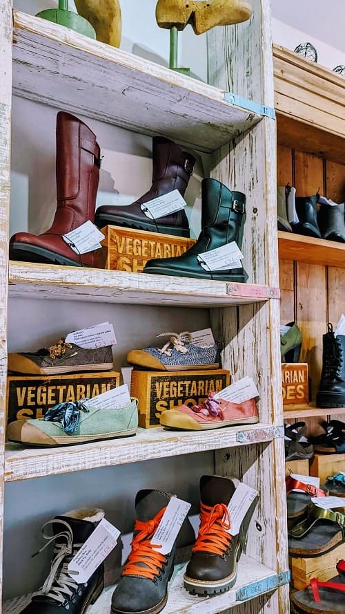 wall filled with vegan shoes and boots at the vegetarian shoe shop