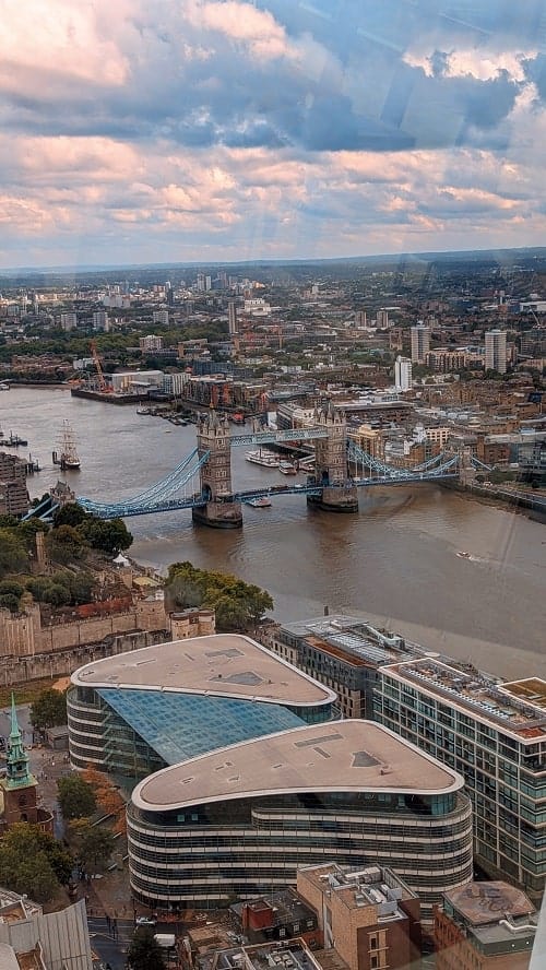 view of tower bridge on a stormy day from sky garden