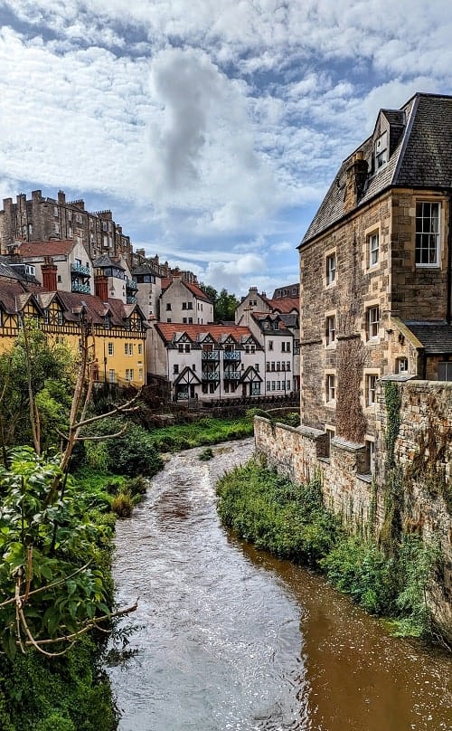 charming dean village with the water of leith river running through the middle in edinburgh