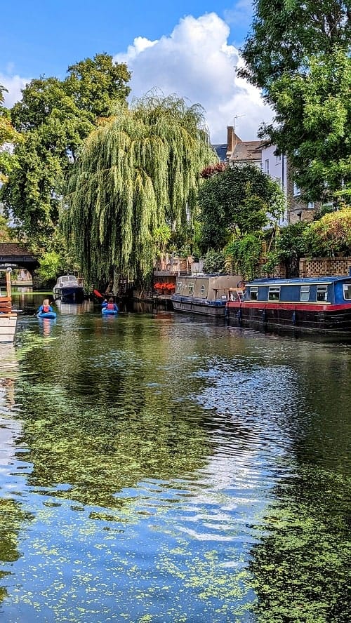 houseboats sitting in the little venice canal in london