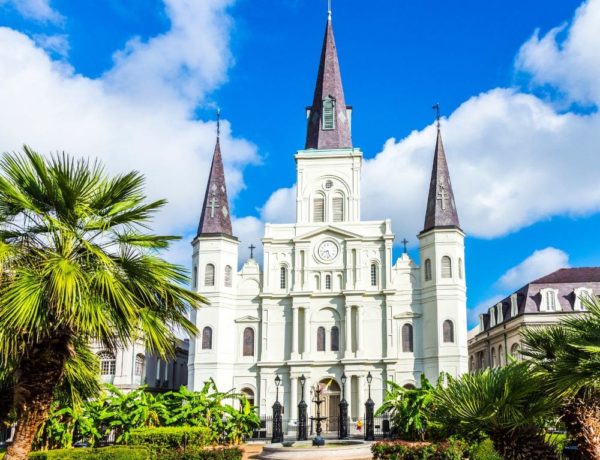 the st louis cathedral in the heart of new orleans on a bright and sunny day