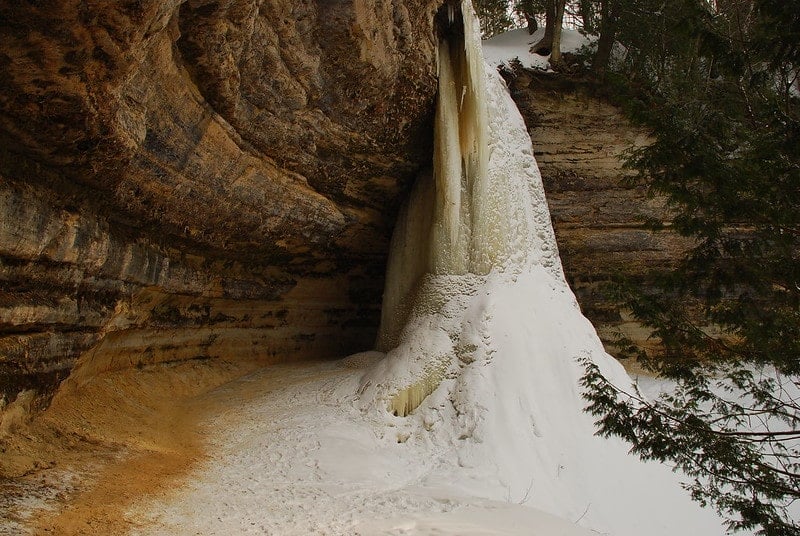 frozen munising falls waterfall in the winter in pictured rocks