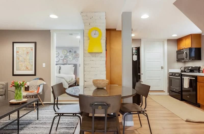 inside of a bright and modern airbnb with neutral colors and wood floors in capitol hill in seattle