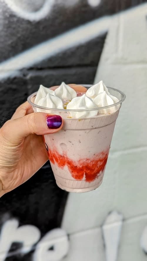 vegan strawberry milkshake topped with meringue clouds at milkway in austin