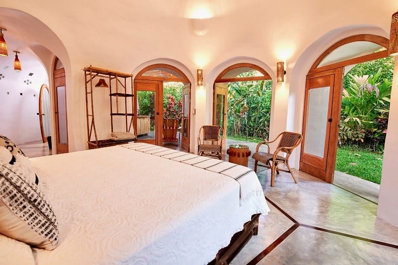 inside of a guest room that looks out into the jungle at the vegan friendly finca luna resort in costa rica
