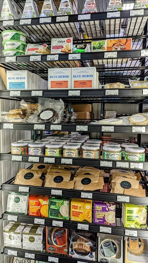 a display of vegan cheese products at the vegan supply in vancouver