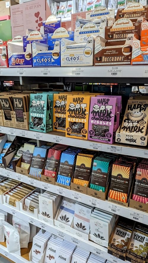 a large display of vegan chocolate products at the vegan supply in vancouver
