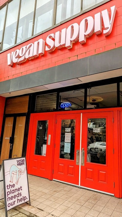 the red front entrance to the vegan supply in vancouver