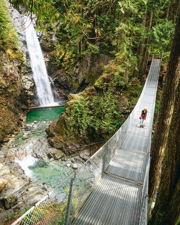 the beautiful cascade waterfall and suspension bridge in vancouver