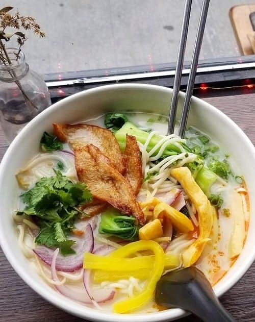 vegan ginger miso ramen with bok choy, smoked seitan, picked bamboo and radish, onions, cilantro, and noodles in a silky coconut miso broth from luanne's wild ginger in brooklyn