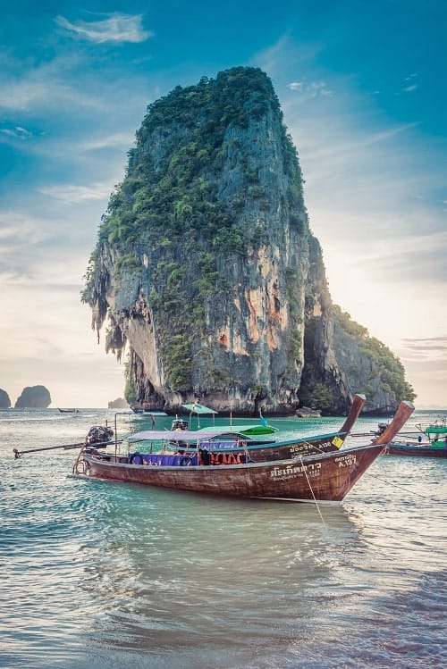 long tailed boat in the water near phi phi islands in thailand
