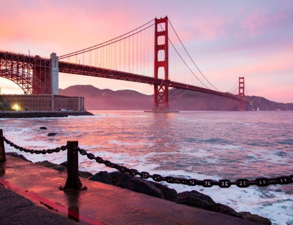 golden gate bridge at sunset with a pink and purple sky in san francisco