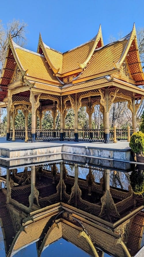 thai pavilion in front of a reflecting pool in madison