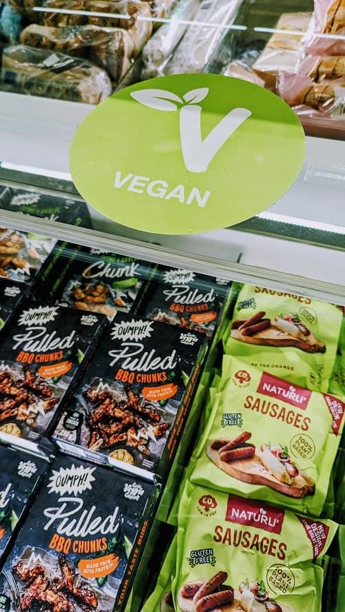 frozen vegan meals with a green v sign above them at the kronan market in Reykjavik