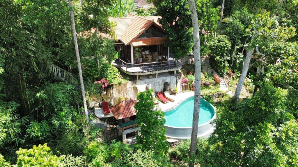 outside view of a small pool isolated in the jungle in bali