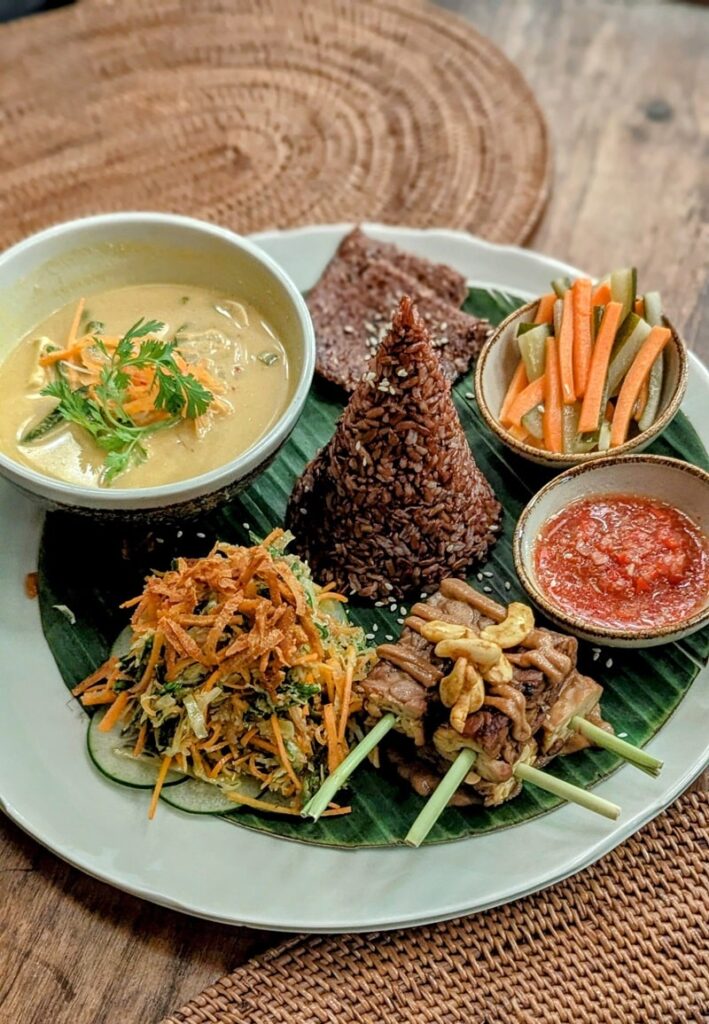 vegan Balinese platter with rice, tempeh, and salad at fivelements retreat in bali 